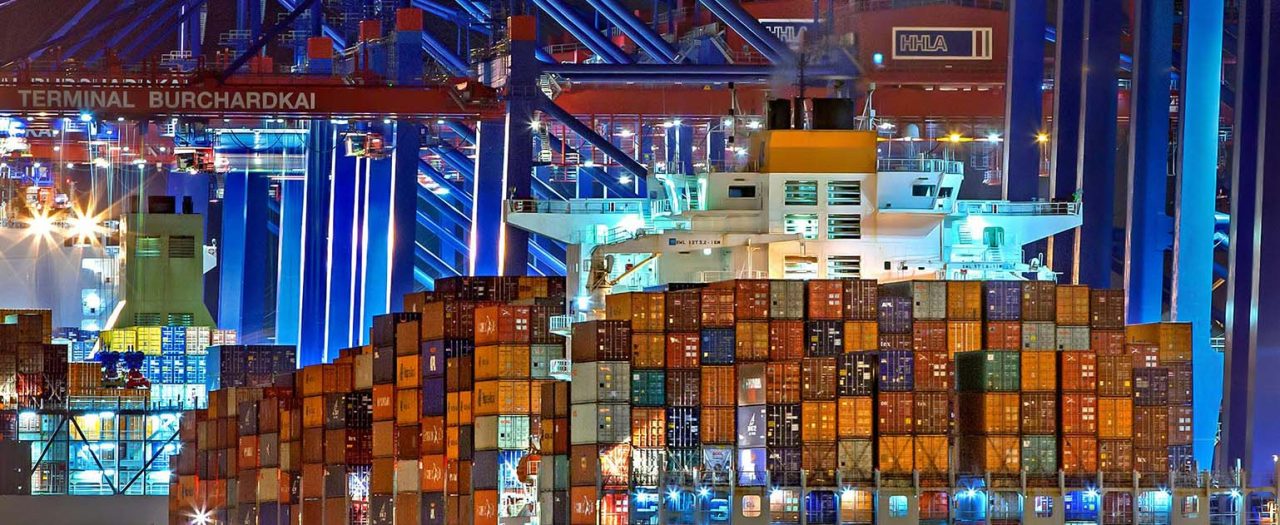 Cargo ship with containers at night